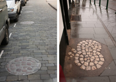 Circles of setts in the road and pavement on Bailgate